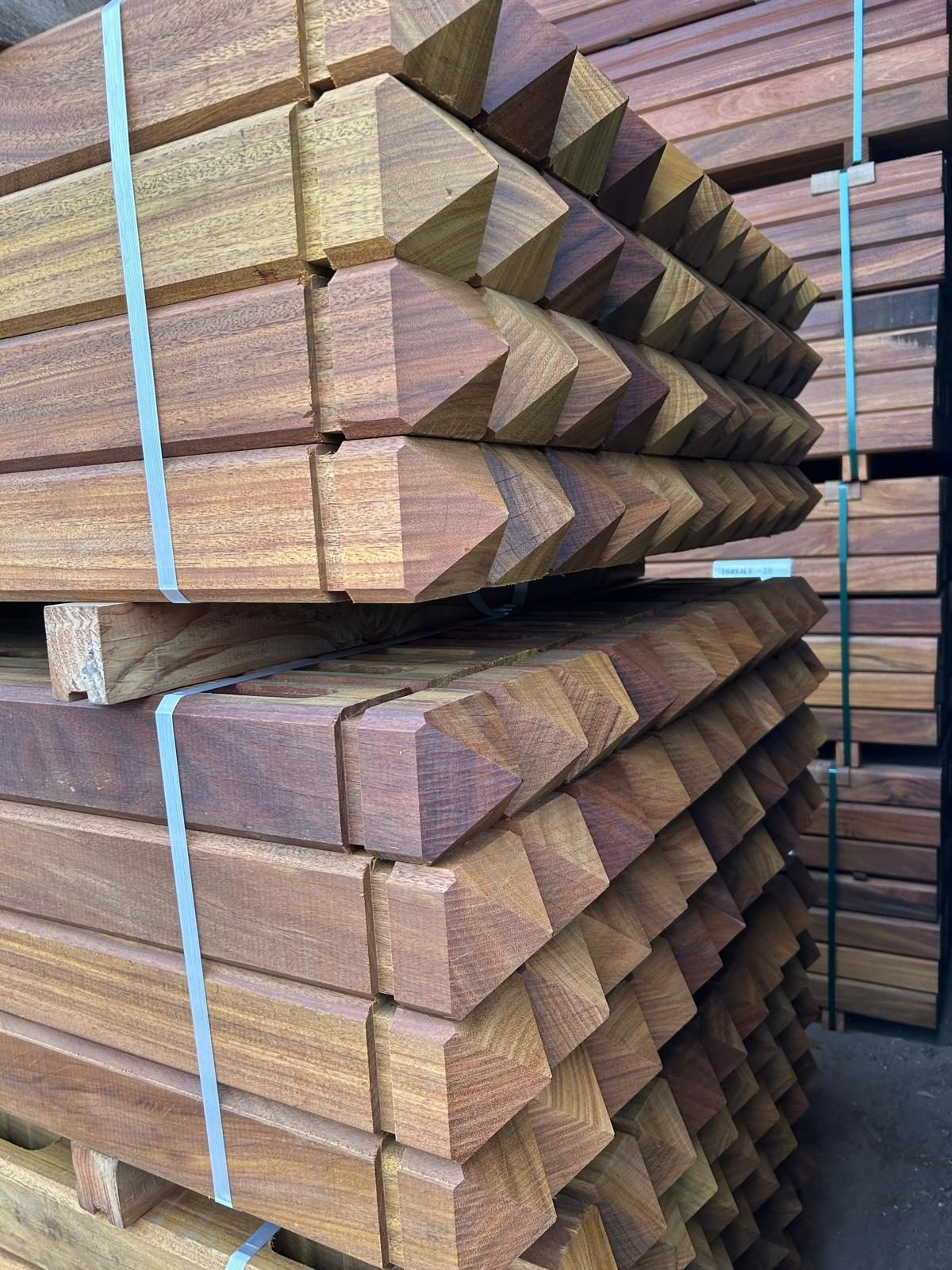 Pyramid-headed hardwood posts bundled for delivery