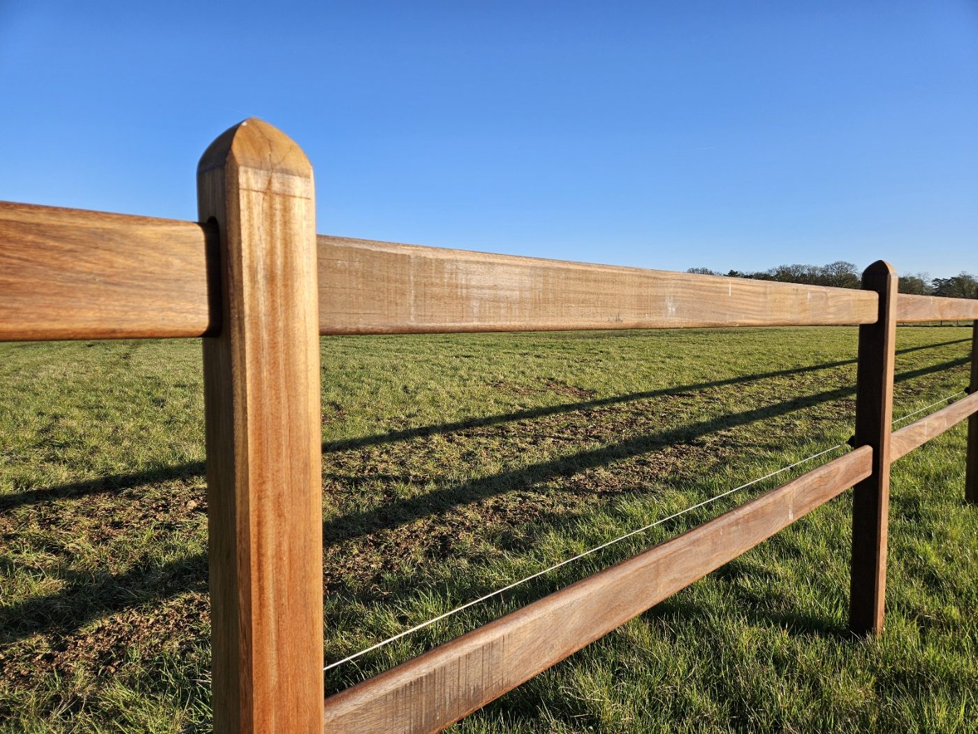 Okan hardwood rail and post detail in golden light